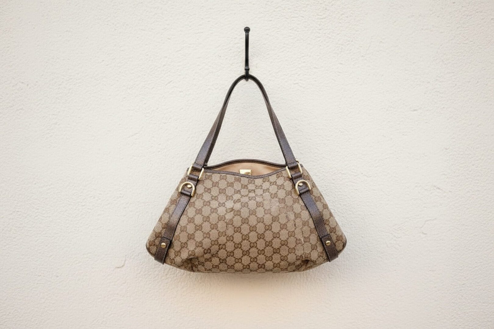 Elegant shoulder bag against a plain background.